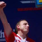 WATCH: Joey Chestnut takes down a protester for animal rights while winning the hot dog eating contest