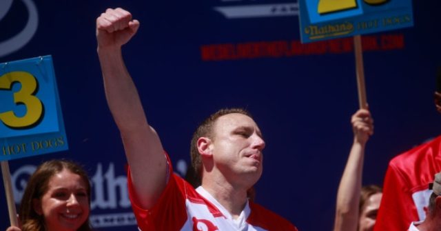 WATCH: Joey Chestnut takes down a protester for animal rights while winning the hot dog eating contest